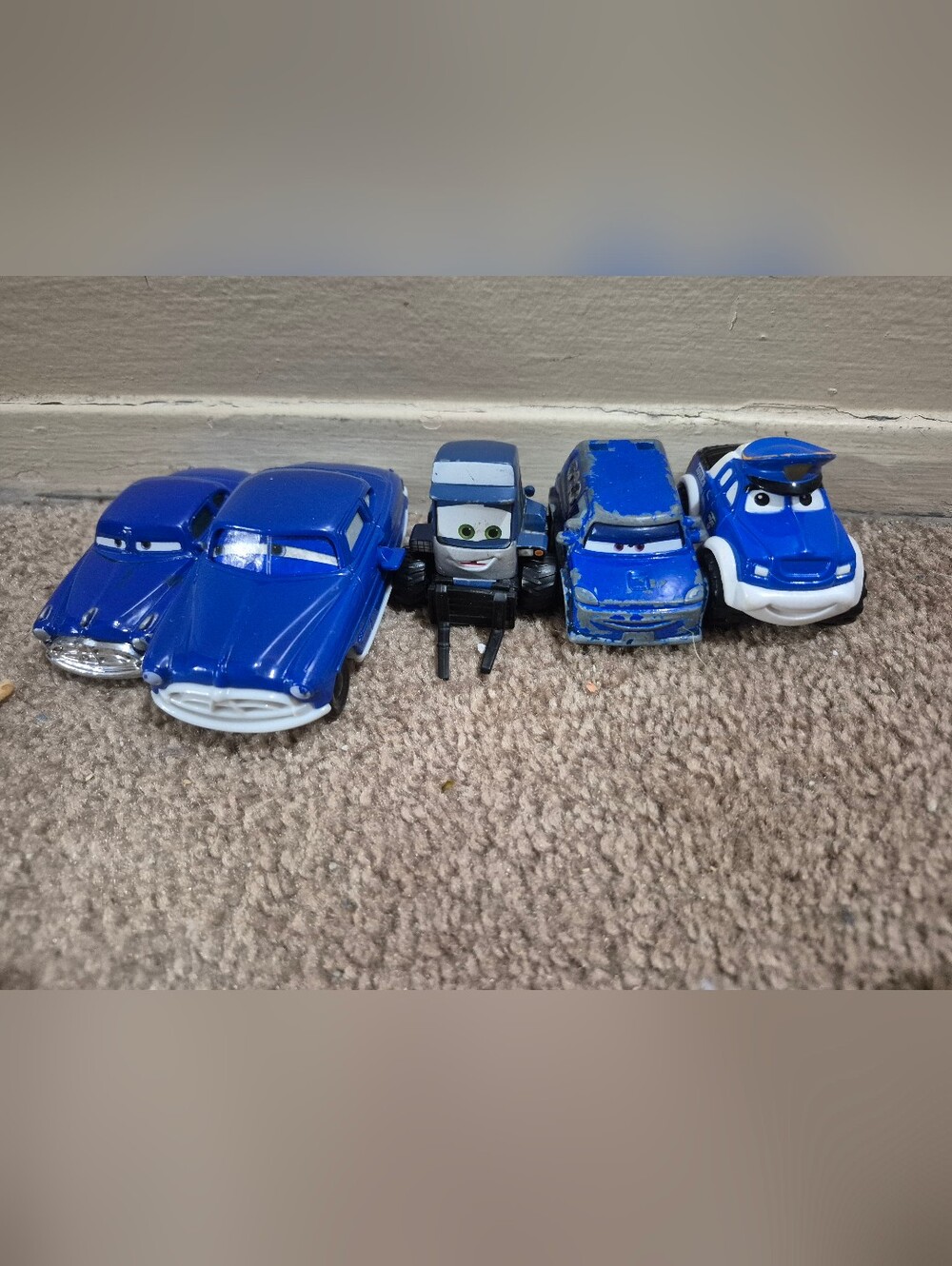 5 blue pixar cars